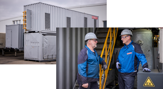 Mobile Atex-Dekanter auf einem Betribsgelände sowie zwei Mitarbeitende in Schutzkleidung und Helmen im Gespräch)